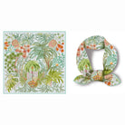 Tropical-themed scarf with palm trees and flowers on a white background