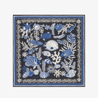 Navy blue scarf with blue and white marine life pattern on a white background