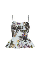 Floral peplum top on a white background