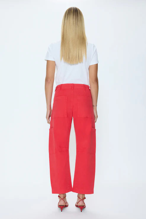 Person wearing a white t-shirt and red pants on a white background