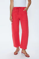 Person wearing red pants on a white background