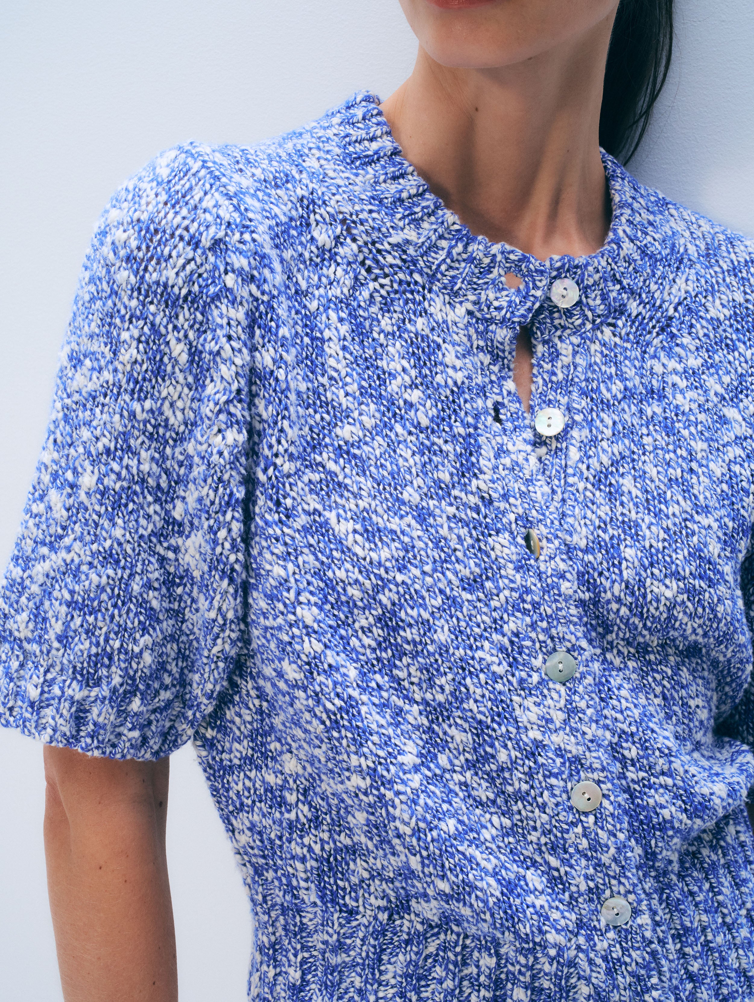 Close-up of a blue floral dress with a white background
