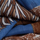 Close-up of fabric with brown, blue, and white pattern