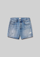 Blue denim shorts on a gray background