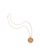 Gold necklace with a butterfly pendant on a white background