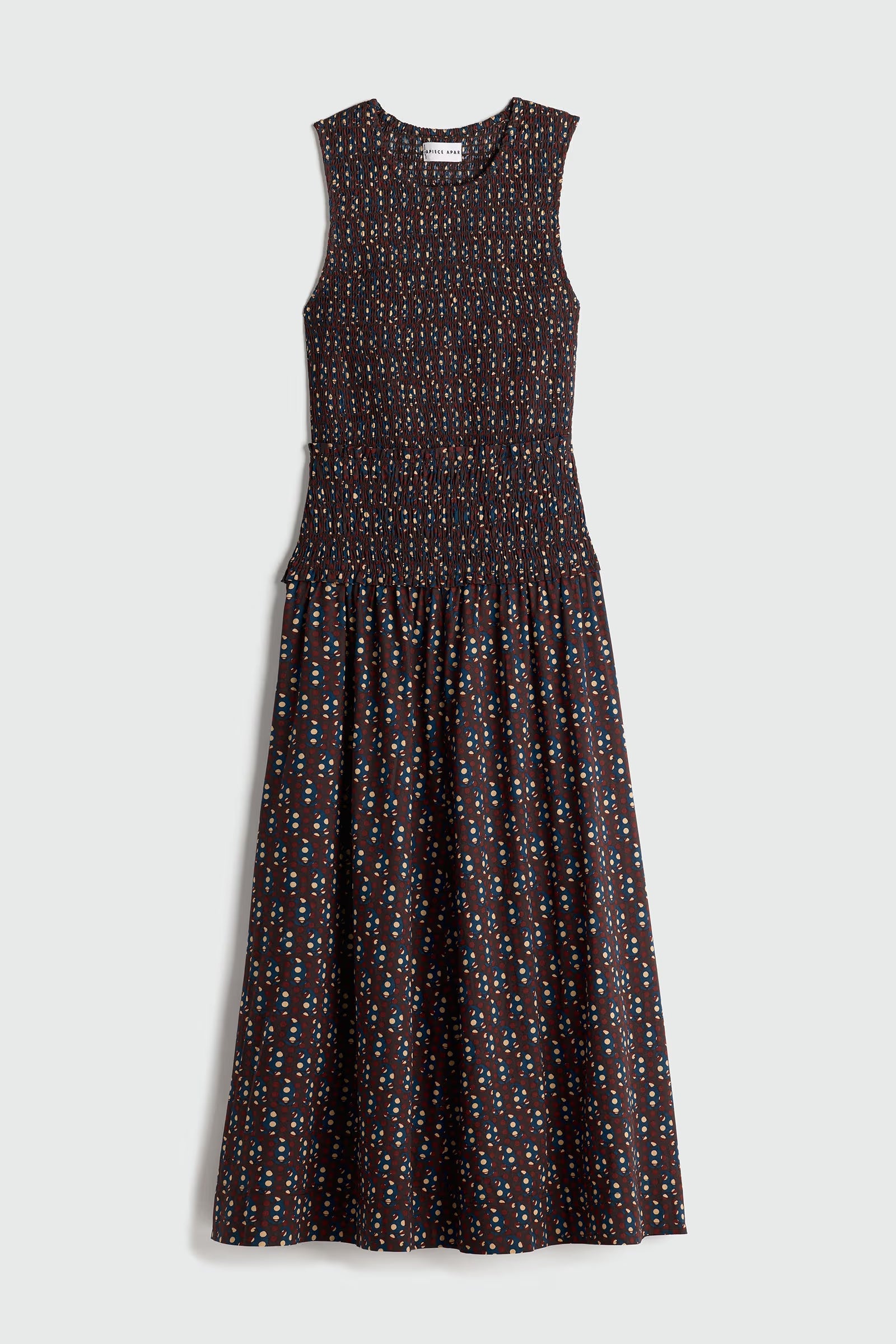 Sleeveless dress with a pattern on a white background