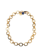 Gold chain bracelet with a blue gemstone on a white background