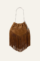 Brown suede handbag with fringes on a white background