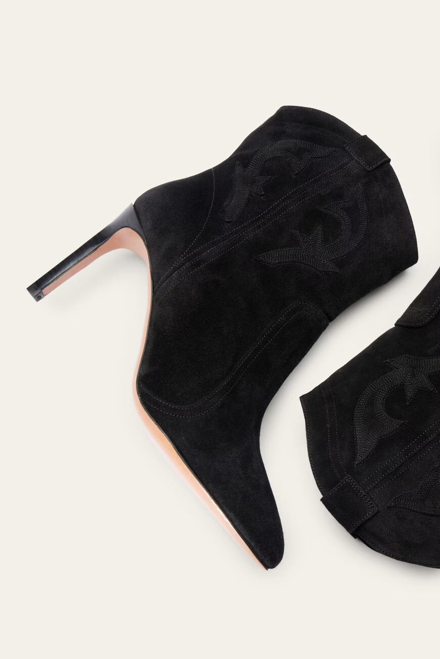 Black high-heeled shoes on a white background