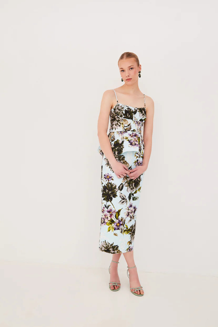 Woman wearing a floral dress on a white background