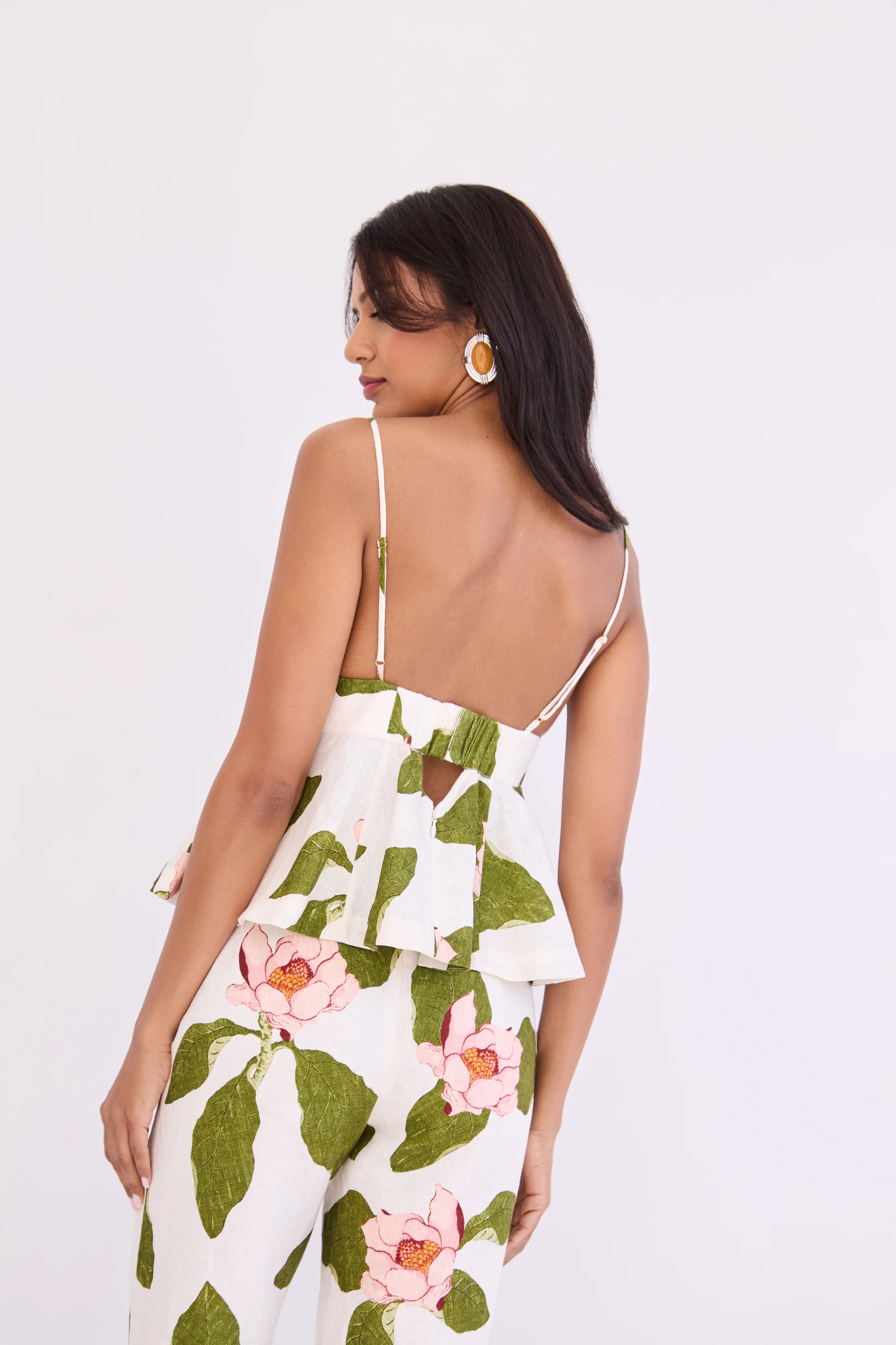 Woman wearing a floral dress with a white background
