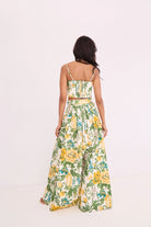 Woman wearing a floral dress on a white background
