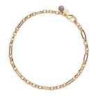 Gold chain bracelet on a white background