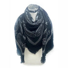 Navy blue scarf with white paisley pattern on a mannequin against a white background