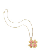 Gold necklace with a pink flower pendant on a white background