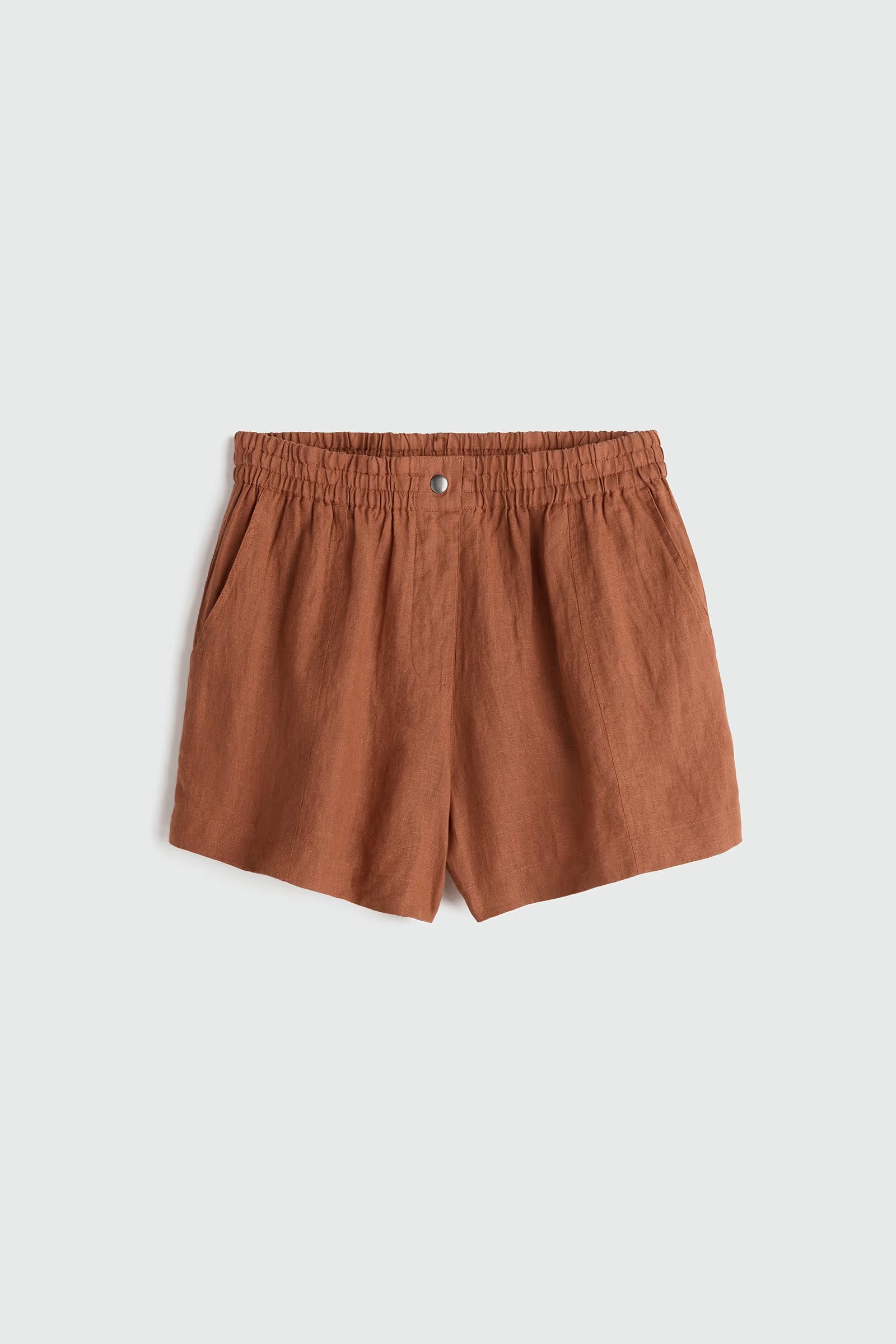Brown shorts on a light gray background