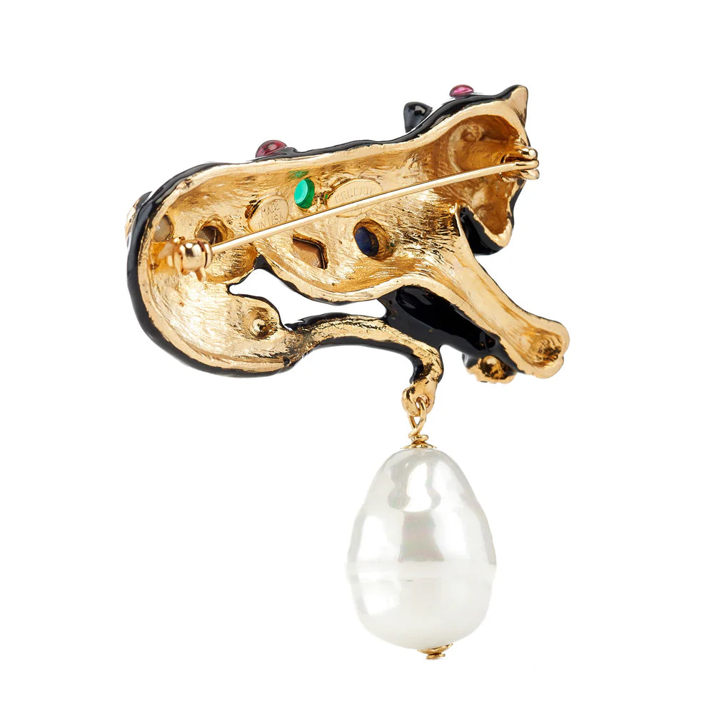 Gold fox brooch with a pearl drop on a white background