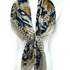 Decorative scarf with blue and yellow patterns on a white background