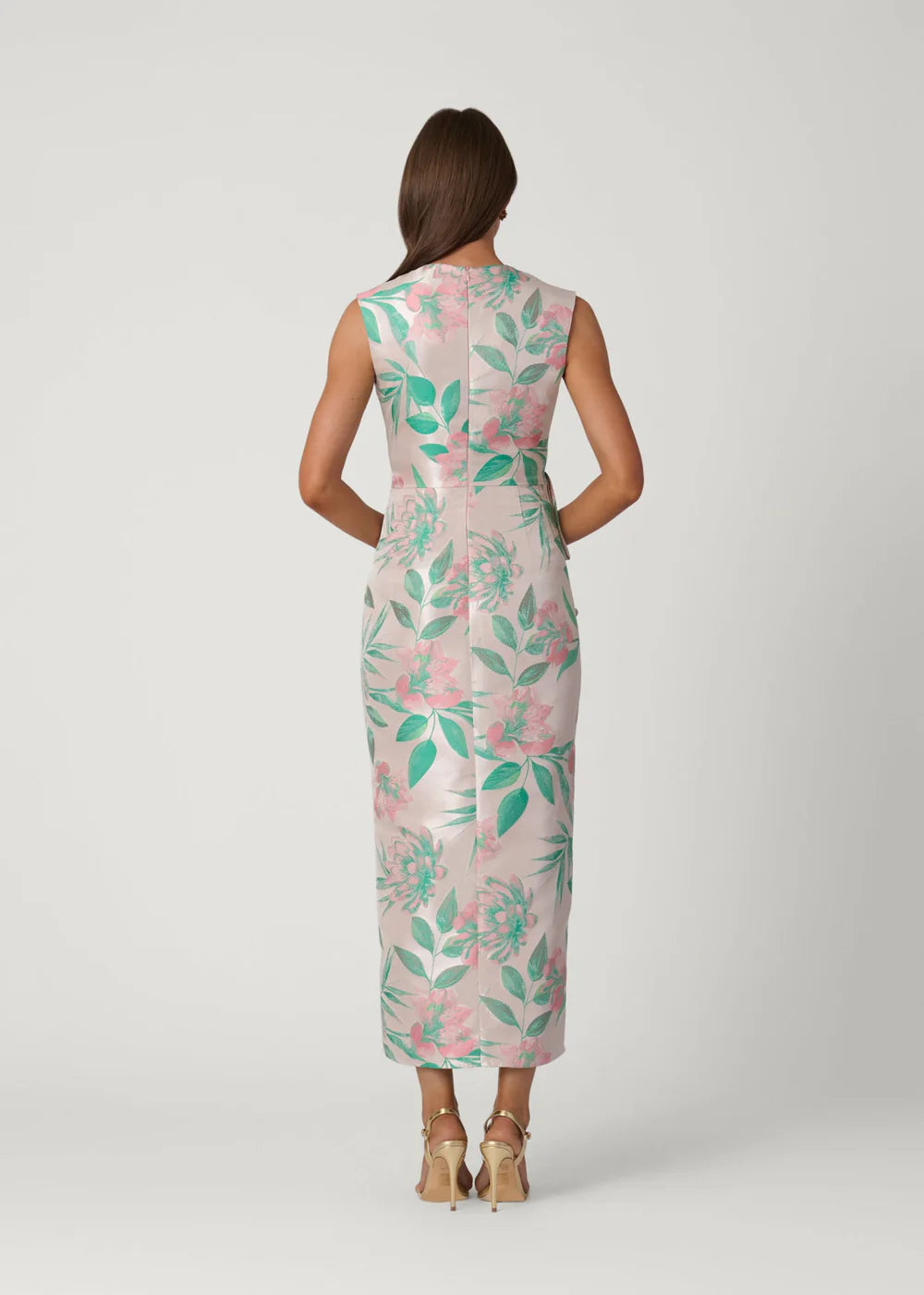 Woman wearing a floral dress on a white background