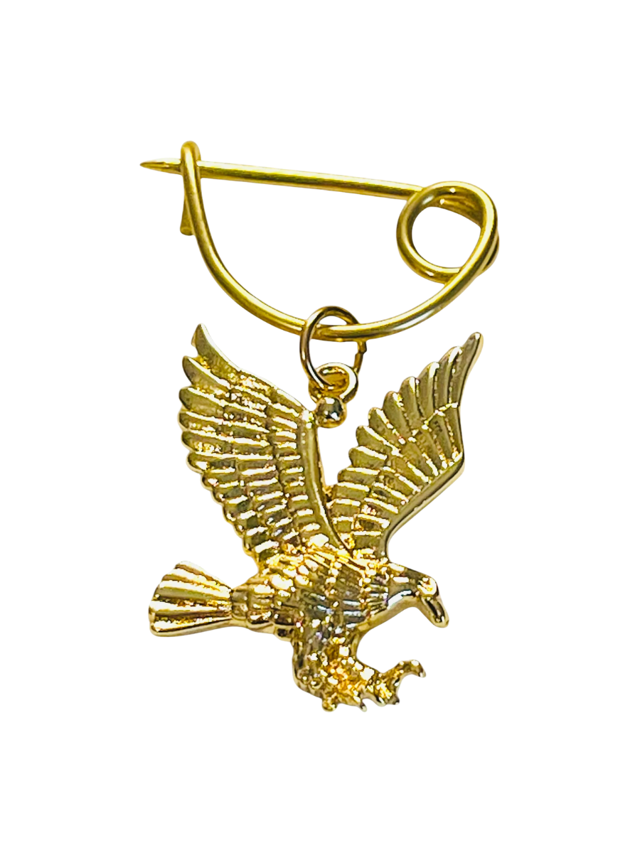 Gold eagle brooch on a white background