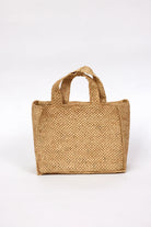 Woven brown bag on a white background