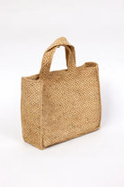 Woven natural bag on a white background