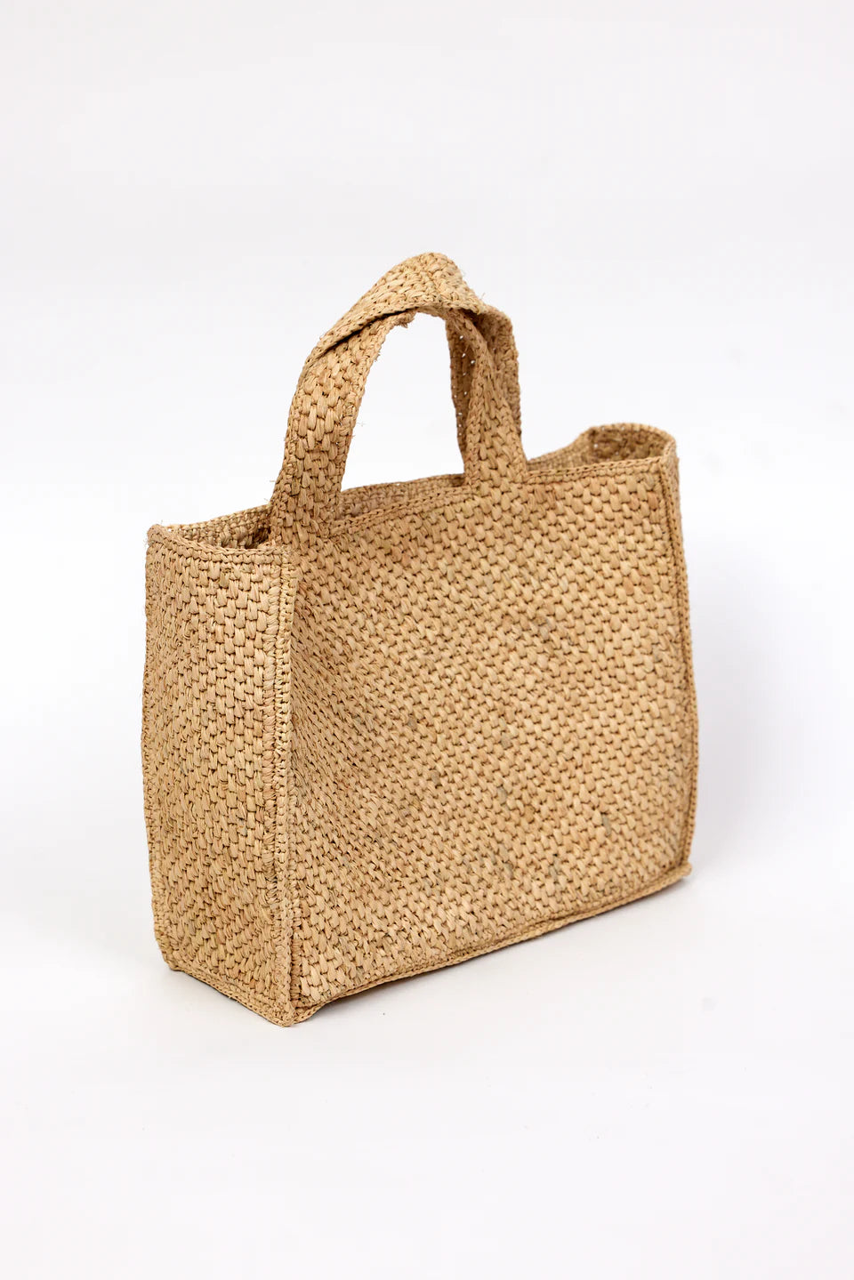 Woven natural bag on a white background