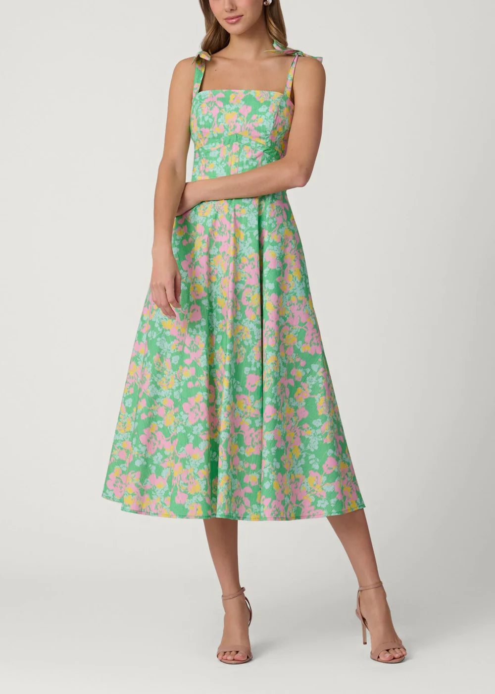 Woman wearing a floral dress on a white background