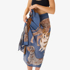 Woman wearing a blue skirt with dog pattern on a white background