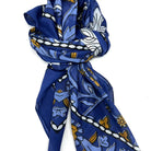 Blue patterned scarf on a white background