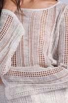 Close-up of a textured off-shoulder top with intricate patterns.
