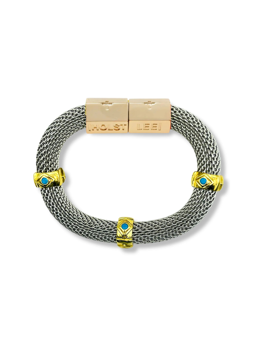 Bracelet with gold and silver design on a white background