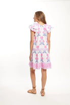 Woman wearing a floral dress on a white background