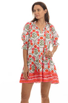 Woman wearing a floral dress on a white background