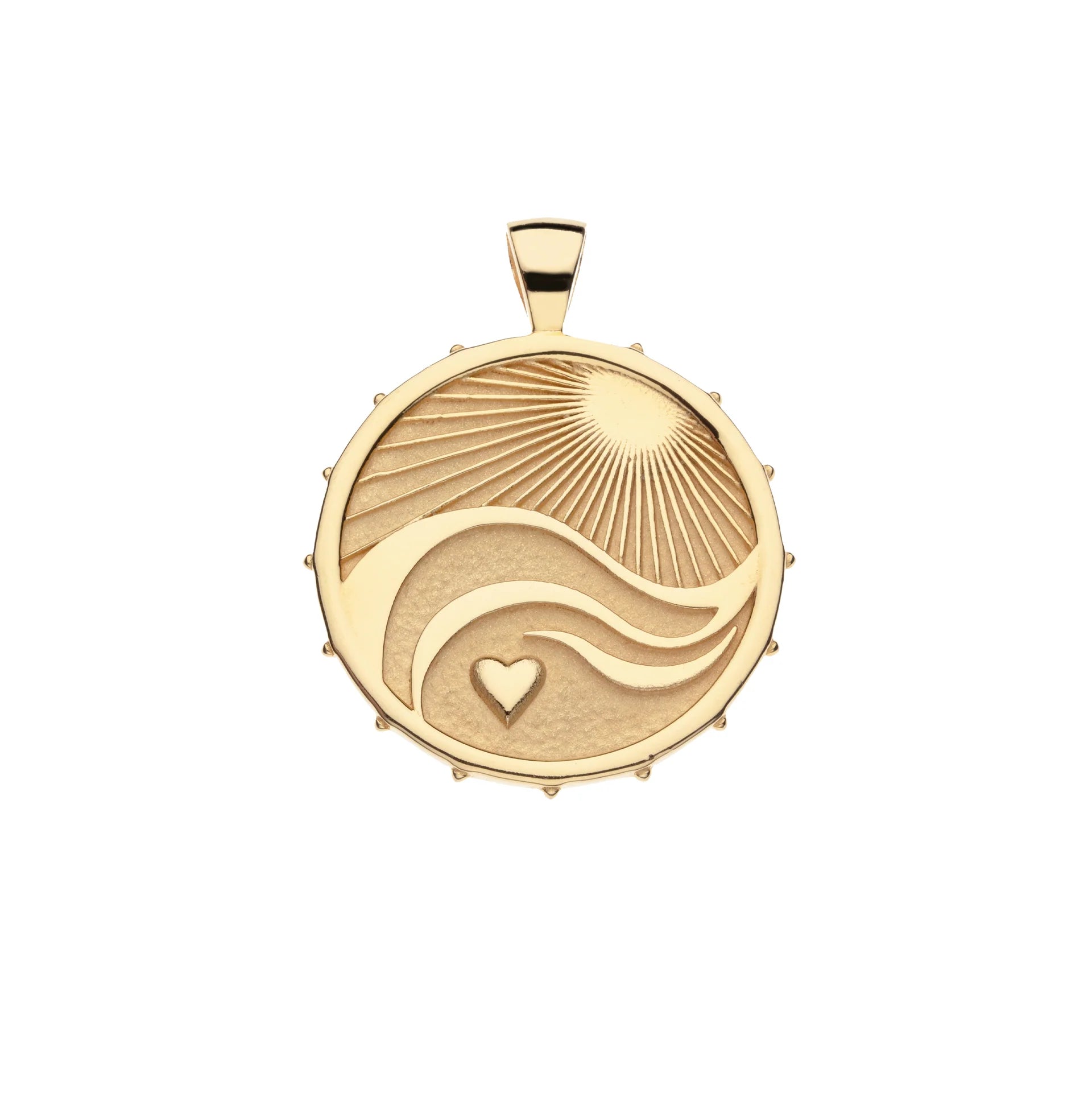 A gold pendant featuring a sunburst, flowing wave lines, and a small heart, shown on a plain white background.