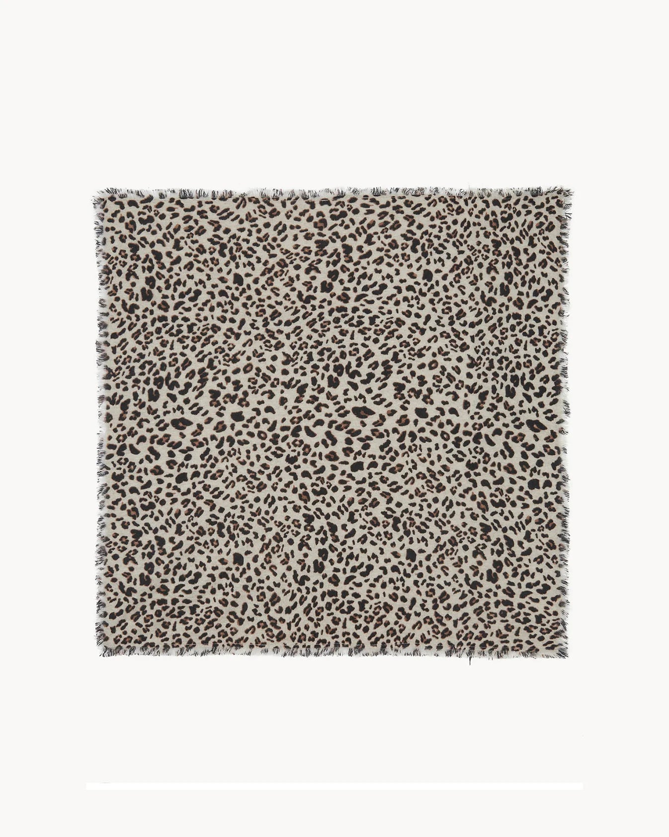 A square textile swatch with a dense leopard print pattern in black and dark brown on a warm beige background, finished with short fringe on all sides.