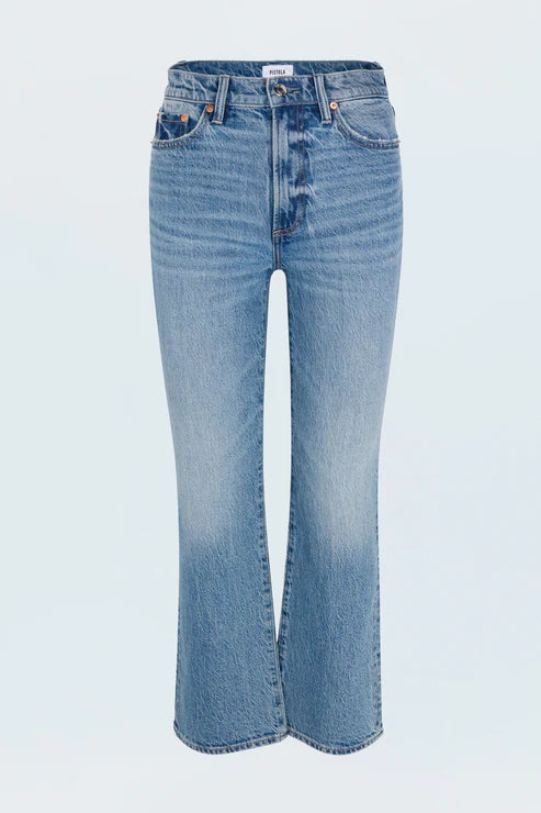 Blue jeans on a light gray background