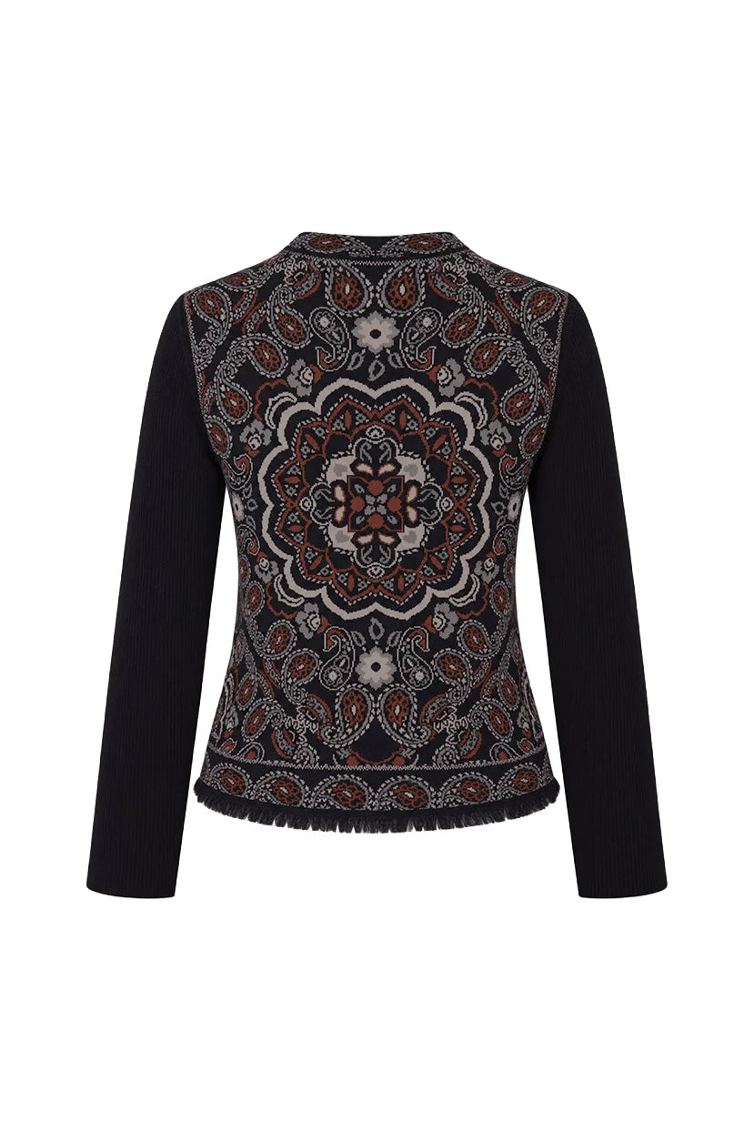 A long-sleeve knit top with solid black sleeves and a highly detailed, multicolored mandala pattern across the body, shown against a plain white background.