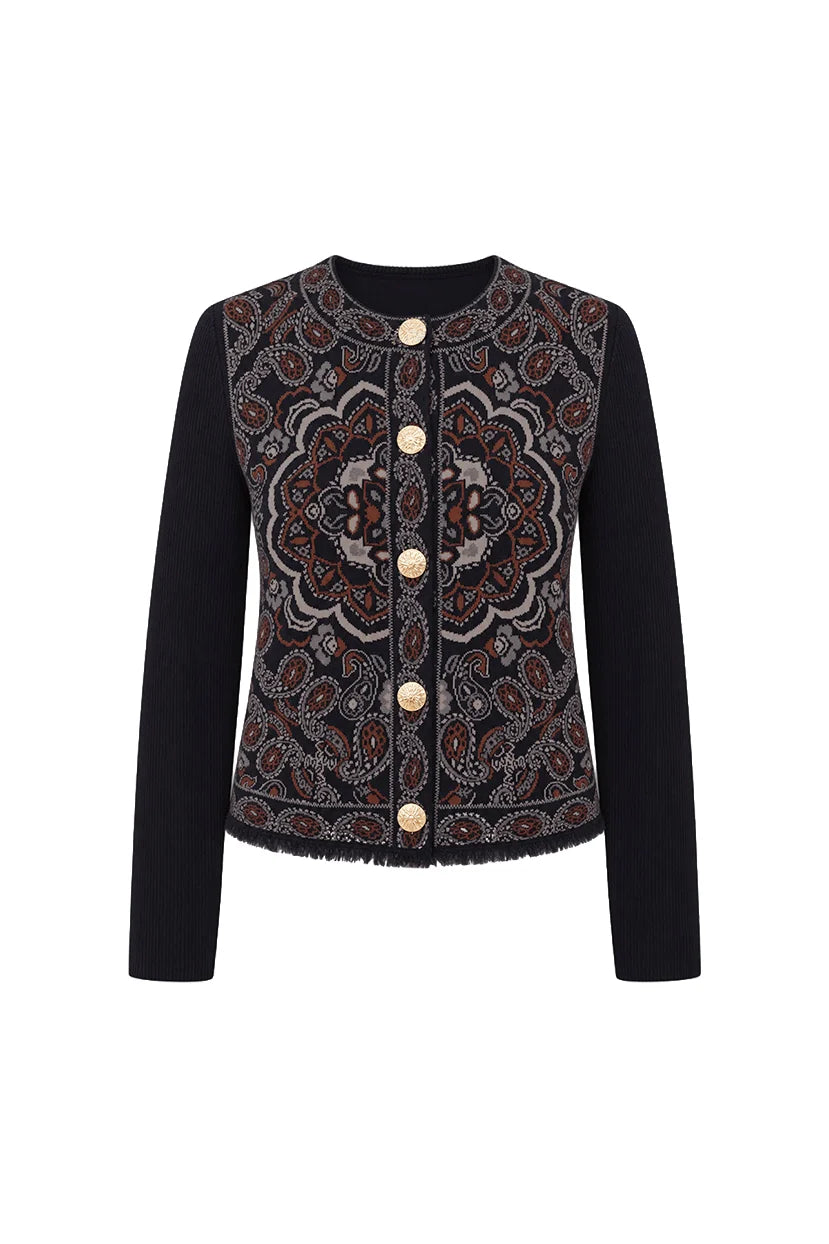A women's cropped jacket featuring solid black long sleeves and a heavily embroidered front panel with a detailed mandala pattern in brown, beige, and red tones, accented by gold buttons.