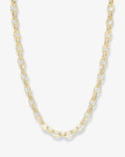 A gold chain necklace with elongated oval links, displayed against a clean, light off-white background.