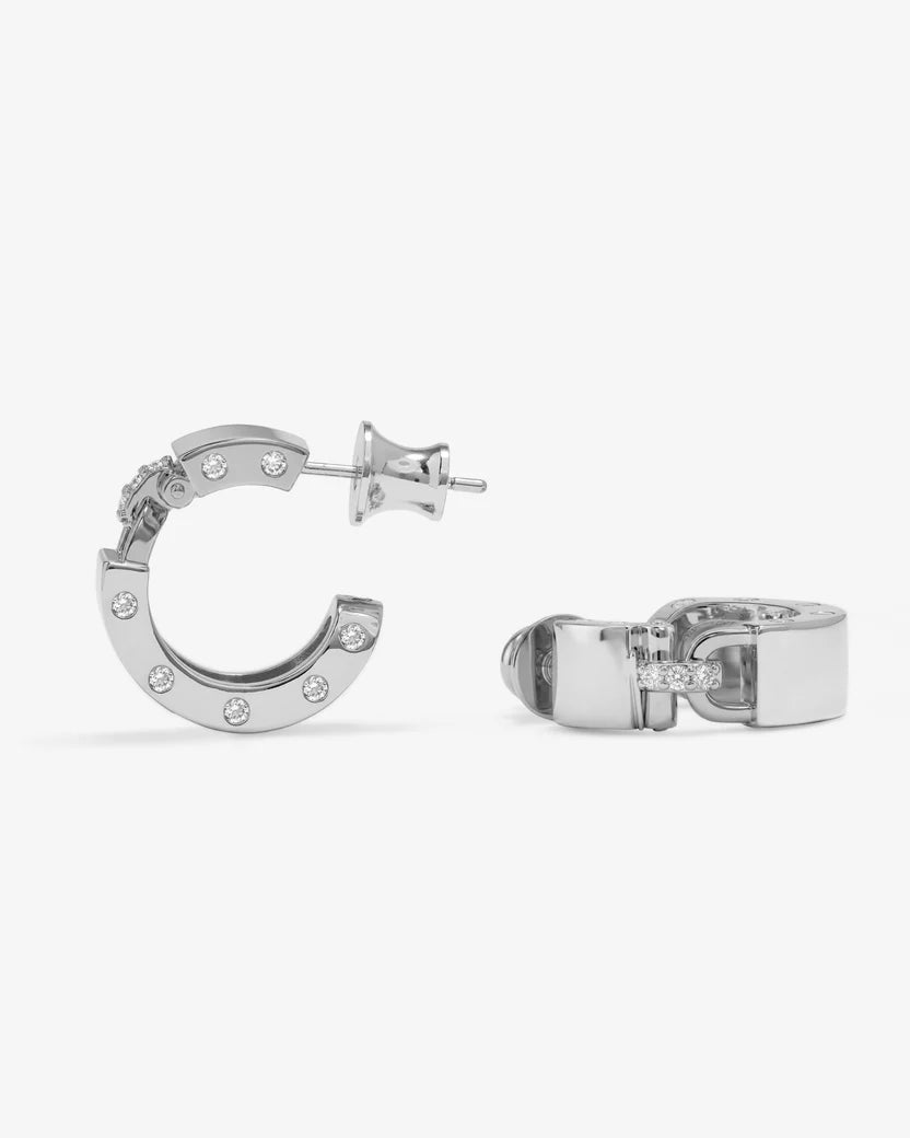 Silver hoop earrings with small diamonds on a white background