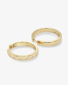 Pair of gold hoop earrings with embedded stones on a white background