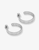 Pair of silver hoop earrings with embedded stones on a white background