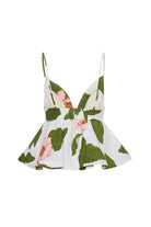Floral dress with green leaves and pink flowers on a white background