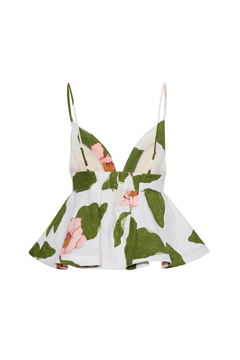 Floral dress with green leaves and pink flowers on a white background