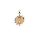 Gold pendant with gemstones on a white background