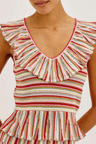 Multicolored striped dress with ruffled neckline on a white background