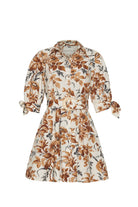 Floral dress with brown and beige pattern on a white background