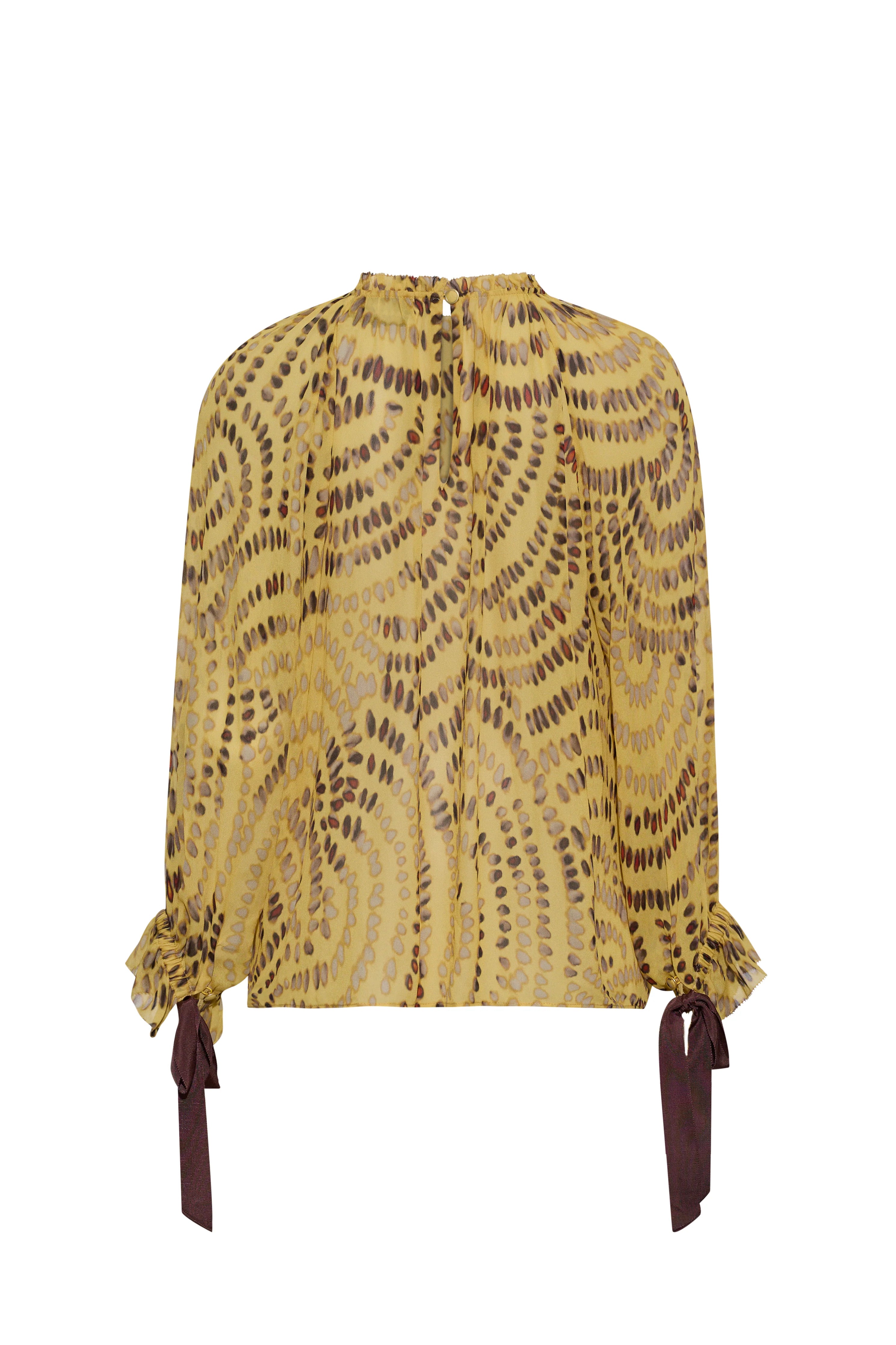 Yellow patterned blouse with long sleeves and tie details on a white background