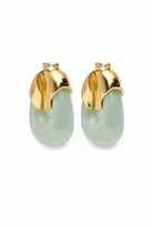 A pair of gold hoop earrings with a light green jade-like drop pendant, shown on a plain white background.